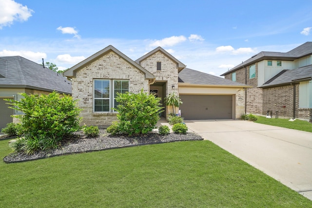 2849 Terrace Grove Dr, Conroe, TX 77304 - view of front of home featuring an attached garage, a front yard, and driveway