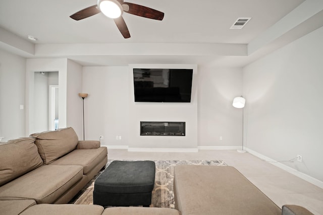 2849 Terrace Grove Dr, Conroe, TX 77304 - living room with a ceiling fan and a glass covered fireplace