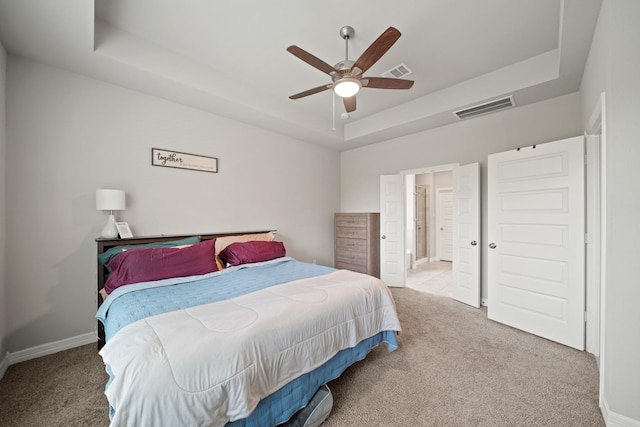 2849 Terrace Grove Dr, Conroe, TX 77304 - bedroom featuring a tray ceiling, carpet, and ceiling fan