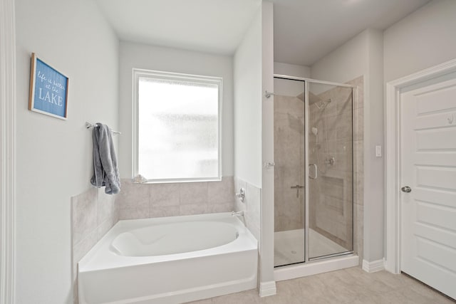 2849 Terrace Grove Dr, Conroe, TX 77304 - full bath with a bath, a stall shower, and tile patterned flooring