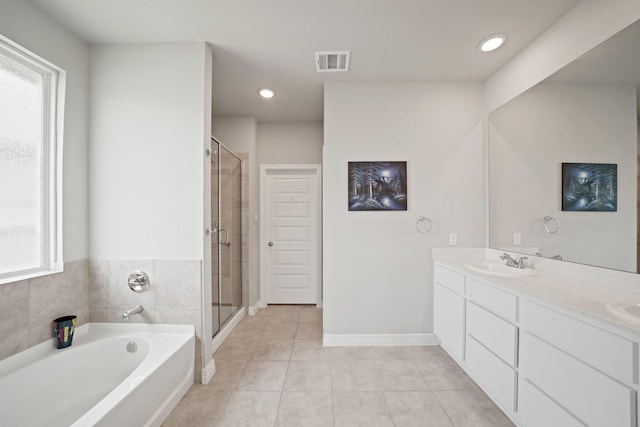 2849 Terrace Grove Dr, Conroe, TX 77304 - bathroom with tile patterned floors, a garden tub, a shower stall, double vanity, and recessed lighting