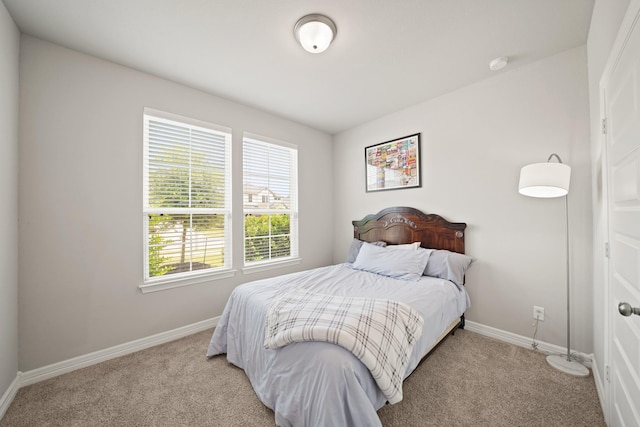 2849 Terrace Grove Dr, Conroe, TX 77304 - bedroom featuring light carpet and baseboards