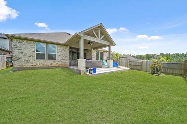 2849 Terrace Grove Dr, Conroe, TX 77304 - back of property featuring ceiling fan, a patio area, a fenced backyard, brick siding, and an outdoor hangout area