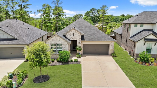 2849 Terrace Grove Dr, Conroe, TX 77304 - view of front of home featuring driveway, an attached garage, and brick siding