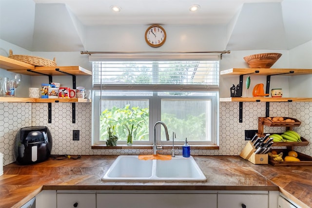 11906 Rowood Dr, Houston, TX 77070 - kitchen featuring open shelves, white cabinets, decorative backsplash, recessed lighting, and wood finished floors