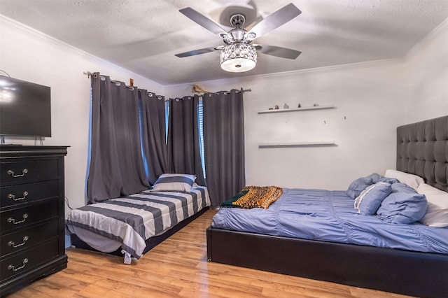 11906 Rowood Dr, Houston, TX 77070 - bedroom with wood finished floors, ornamental molding, and a ceiling fan