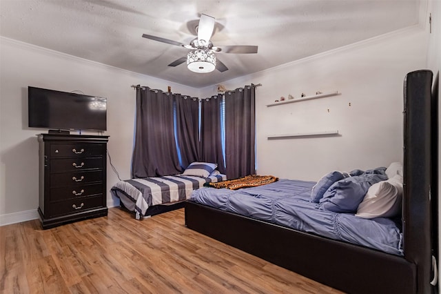 11906 Rowood Dr, Houston, TX 77070 - bedroom featuring light wood finished floors, ornamental molding, and a ceiling fan
