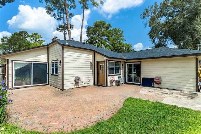 11906 Rowood Dr, Houston, TX 77070 - rear view of house featuring a patio and a shingled roof