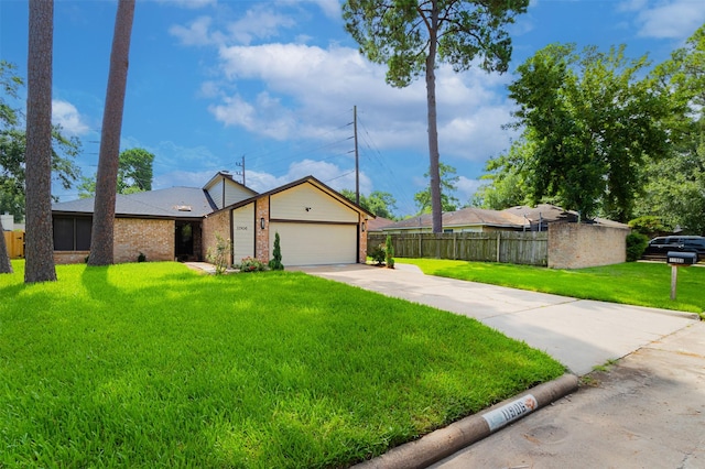 11906 Rowood Dr, Houston, TX 77070 - mid-century home with brick siding, an attached garage, and driveway