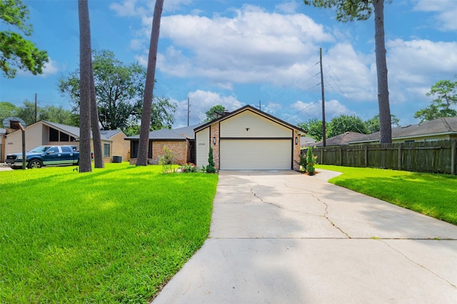 11906 Rowood Dr, Houston, TX 77070 - view of front of home with brick siding, concrete driveway, and a garage