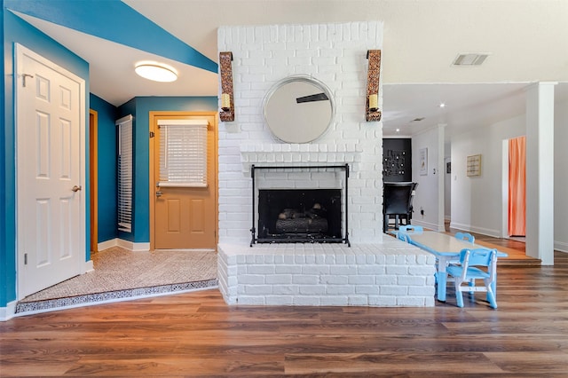 11906 Rowood Dr, Houston, TX 77070 - unfurnished living room with wood finished floors and a fireplace