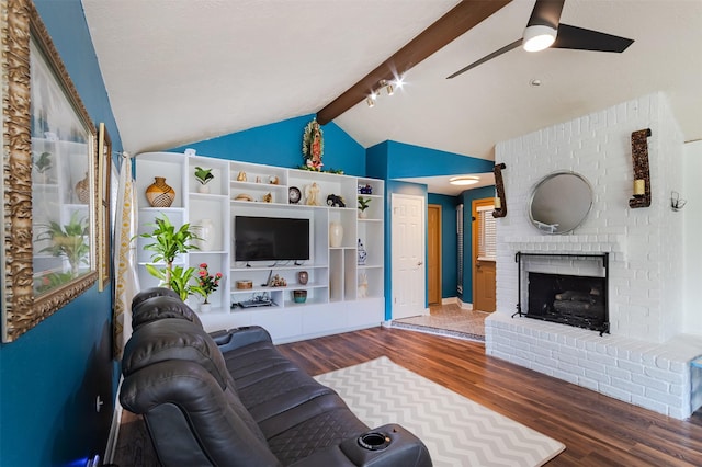 11906 Rowood Dr, Houston, TX 77070 - living area featuring wood finished floors, a ceiling fan, and a brick fireplace