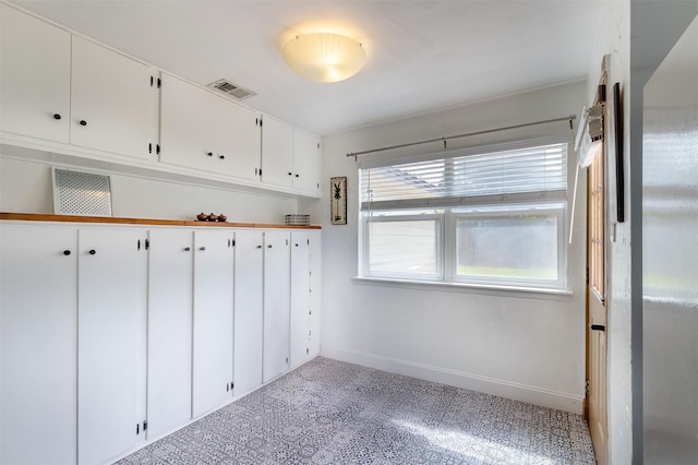 11906 Rowood Dr, Houston, TX 77070 - mudroom featuring baseboards