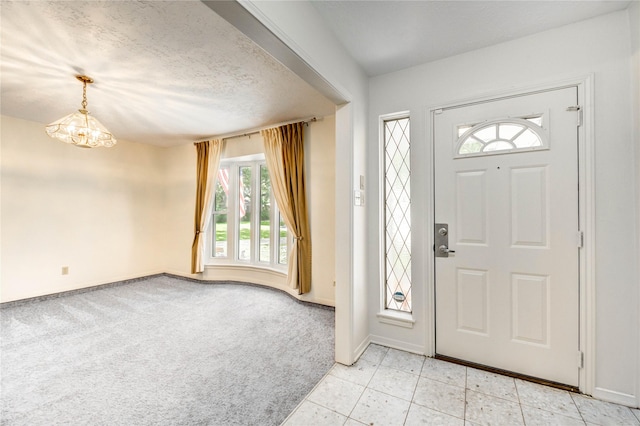 12327 Meadowhollow Dr, Meadows Place, TX 77477 - entryway featuring a chandelier, light colored carpet, and light tile patterned floors
