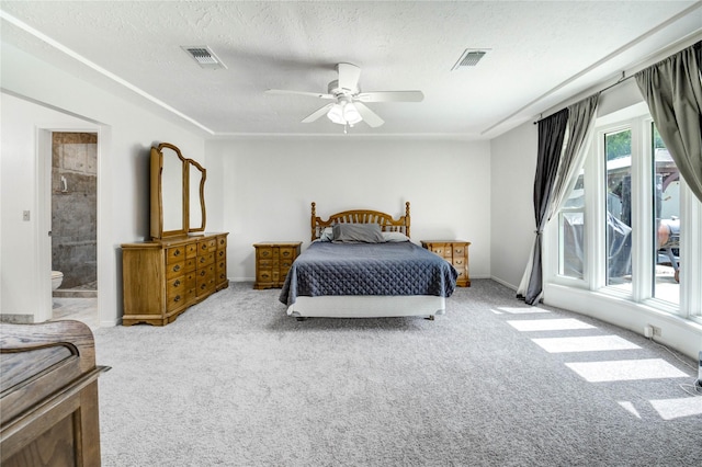 12327 Meadowhollow Dr, Meadows Place, TX 77477 - carpeted bedroom featuring a textured ceiling, a ceiling fan, and ensuite bath