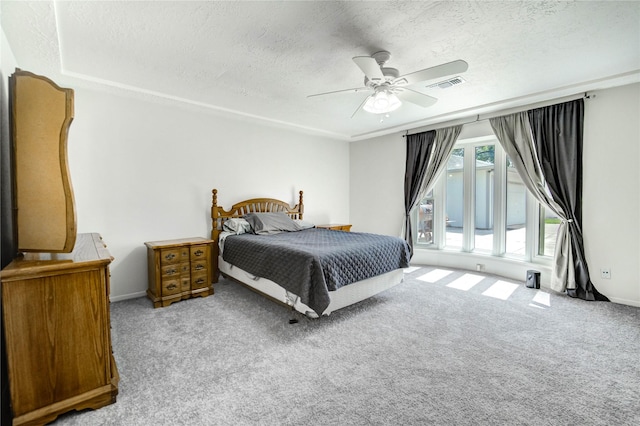 12327 Meadowhollow Dr, Meadows Place, TX 77477 - carpeted bedroom featuring a textured ceiling and a ceiling fan