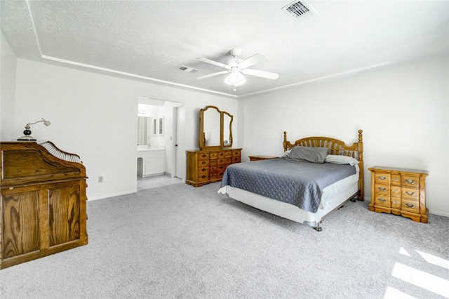 12327 Meadowhollow Dr, Meadows Place, TX 77477 - bedroom with carpet flooring, ceiling fan, ensuite bathroom, and a textured ceiling