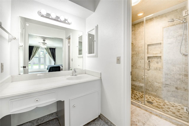 12327 Meadowhollow Dr, Meadows Place, TX 77477 - full bathroom featuring a shower stall, vanity, ceiling fan, and ensuite bath