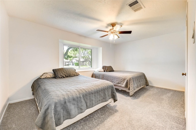 12327 Meadowhollow Dr, Meadows Place, TX 77477 - bedroom with carpet flooring, a ceiling fan, and a textured ceiling