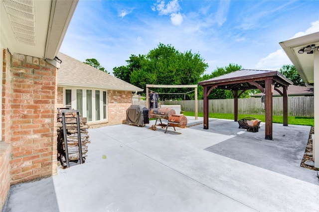 12327 Meadowhollow Dr, Meadows Place, TX 77477 - fenced backyard with area for grilling, a gazebo, and a patio