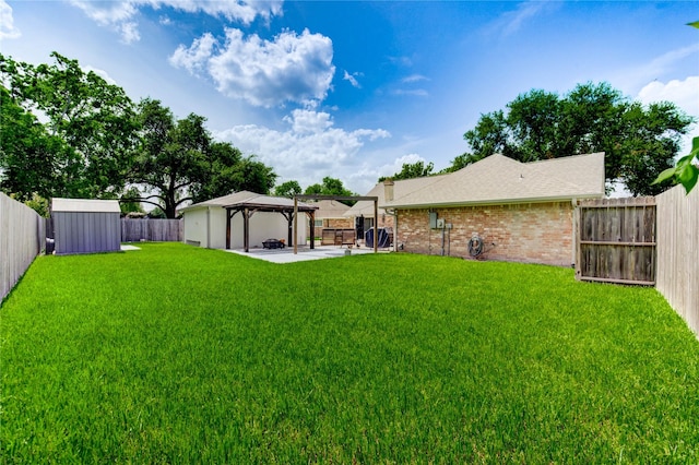 12327 Meadowhollow Dr, Meadows Place, TX 77477 - fenced backyard with a gazebo, a patio area, and a storage unit