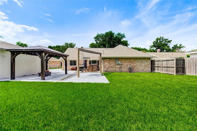 12327 Meadowhollow Dr, Meadows Place, TX 77477 - rear view of house with a gazebo, a patio area, brick siding, and roof with shingles