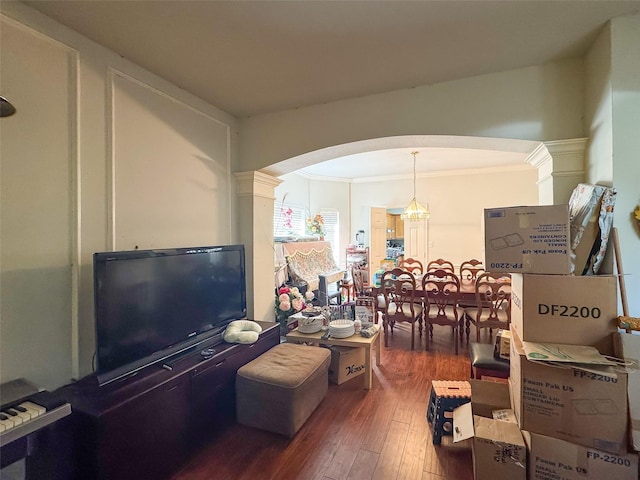 21307 Walden Grove Ln, Katy, TX 77450 - living area featuring arched walkways, ornamental molding, hardwood / wood-style floors, and a chandelier