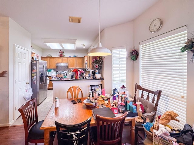 21307 Walden Grove Ln, Katy, TX 77450 - dining space featuring a skylight and light wood-style flooring