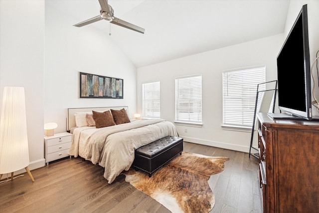 8764 Park Kolbe Ln, Houston, TX 77080 - bedroom featuring wood finished floors, high vaulted ceiling, and ceiling fan