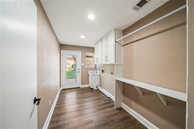 3019 Ramblewood Rd, Montgomery, TX 77356 - washroom featuring cabinet space, hookup for an electric dryer, hookup for a washing machine, dark wood finished floors, and recessed lighting