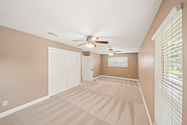 3019 Ramblewood Rd, Montgomery, TX 77356 - unfurnished bedroom featuring light colored carpet, a closet, and a ceiling fan
