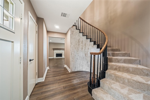 3019 Ramblewood Rd, Montgomery, TX 77356 - stairs with wood finished floors, a fireplace, and recessed lighting