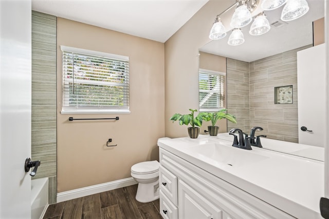 3019 Ramblewood Rd, Montgomery, TX 77356 - full bathroom featuring vanity, a chandelier, and wood finished floors