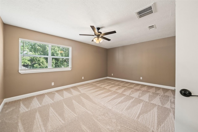 3019 Ramblewood Rd, Montgomery, TX 77356 - unfurnished room with carpet flooring, a ceiling fan, and a textured ceiling