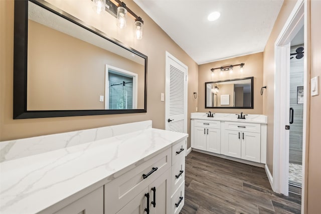 3019 Ramblewood Rd, Montgomery, TX 77356 - full bath with vanity, a shower stall, and wood finished floors