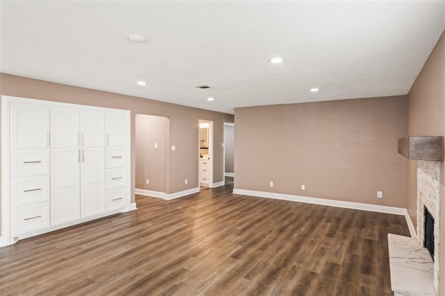 3019 Ramblewood Rd, Montgomery, TX 77356 - unfurnished living room featuring a fireplace, dark wood-style flooring, and recessed lighting