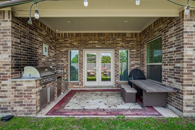 7707 Leighton Trl, Pasadena, TX 77505 - view of patio / terrace featuring french doors and an outdoor kitchen