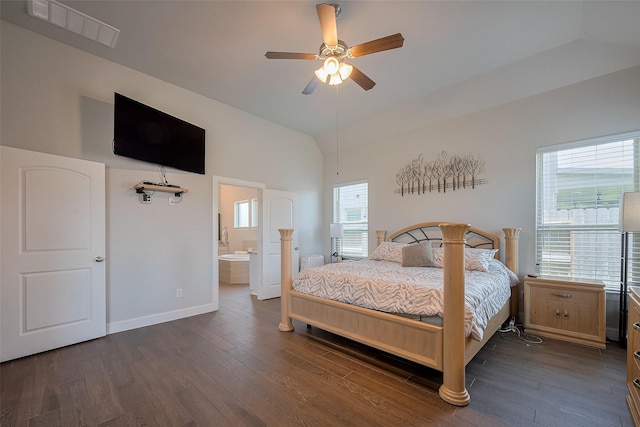 7707 Leighton Trl, Pasadena, TX 77505 - bedroom with dark wood-type flooring, multiple windows, vaulted ceiling, and ensuite bathroom