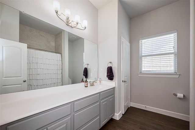 7707 Leighton Trl, Pasadena, TX 77505 - full bath featuring wood finished floors, vanity, and curtained shower