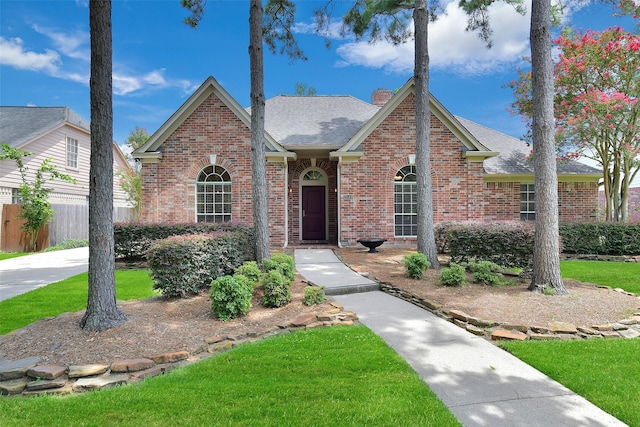 3519 E Pine Brook Way, Houston, TX 77059 - view of front of property with brick siding, a chimney, and a shingled roof