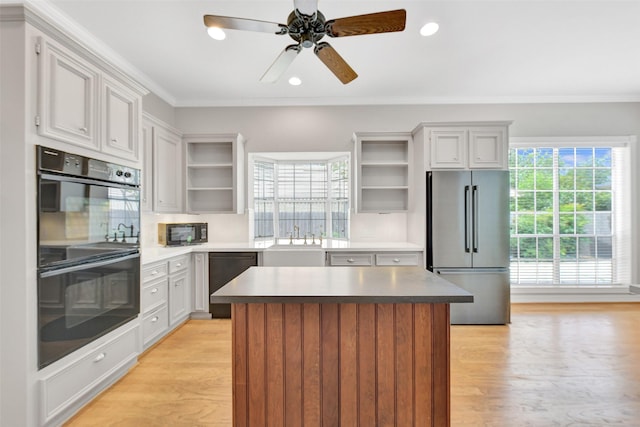 3519 E Pine Brook Way, Houston, TX 77059 - kitchen featuring open shelves, black appliances, a center island, light wood-style flooring, and recessed lighting