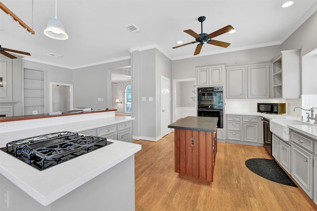 3519 E Pine Brook Way, Houston, TX 77059 - kitchen featuring black appliances, ceiling fan, a kitchen island, open shelves, and light wood-type flooring