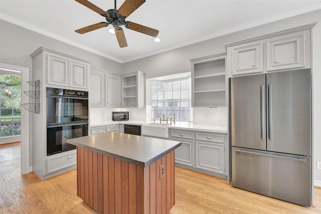 3519 E Pine Brook Way, Houston, TX 77059 - kitchen with freestanding refrigerator, open shelves, healthy amount of natural light, light wood-type flooring, and crown molding
