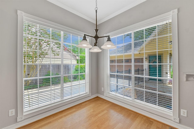 3519 E Pine Brook Way, Houston, TX 77059 - unfurnished dining area with plenty of natural light, wood finished floors, ornamental molding, and a chandelier