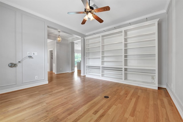 3519 E Pine Brook Way, Houston, TX 77059 - spare room with ornamental molding, a ceiling fan, light wood-style floors, and built in features
