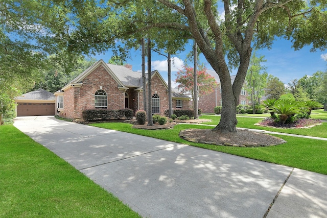 3519 E Pine Brook Way, Houston, TX 77059 - view of front of property featuring brick siding, an outbuilding, a front yard, and a detached garage
