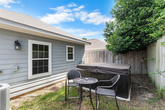16887 Balmoral St, Montgomery, TX 77316 - fenced yard featuring a hot tub and a patio area