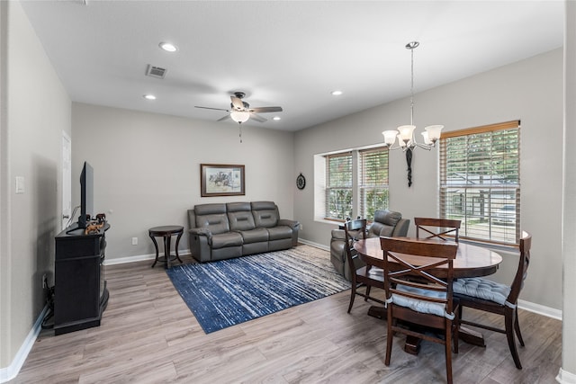 16887 Balmoral St, Montgomery, TX 77316 - dining area with light wood-style floors, a chandelier, ceiling fan, and recessed lighting