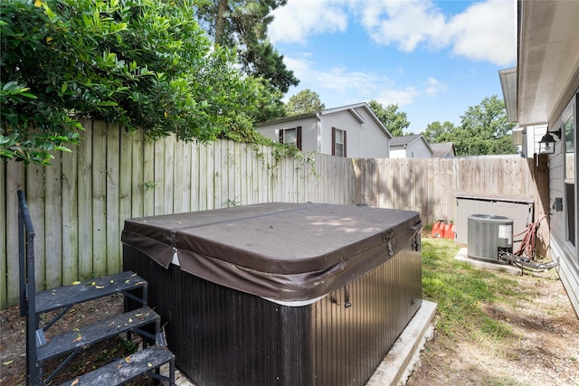 16887 Balmoral St, Montgomery, TX 77316 - fenced backyard featuring a hot tub