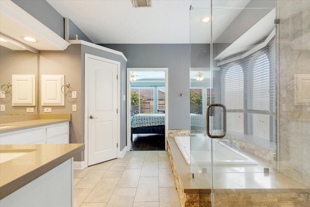 5822 Bailey Springs Ct, Katy, TX 77450 - bathroom with vanity, a bath, an enclosed shower, connected bathroom, and tile patterned floors
